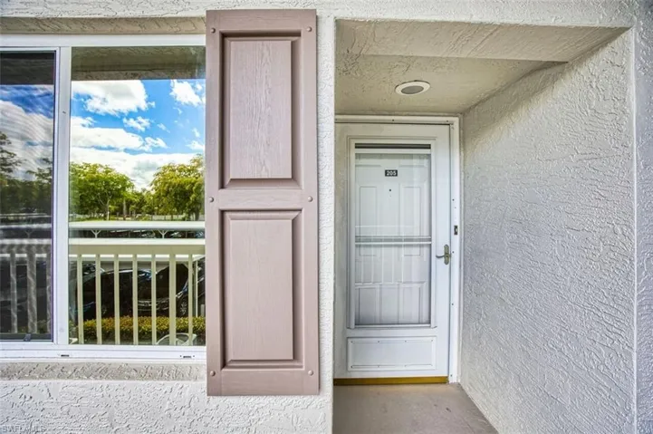 Entrance to property featuring stucco siding