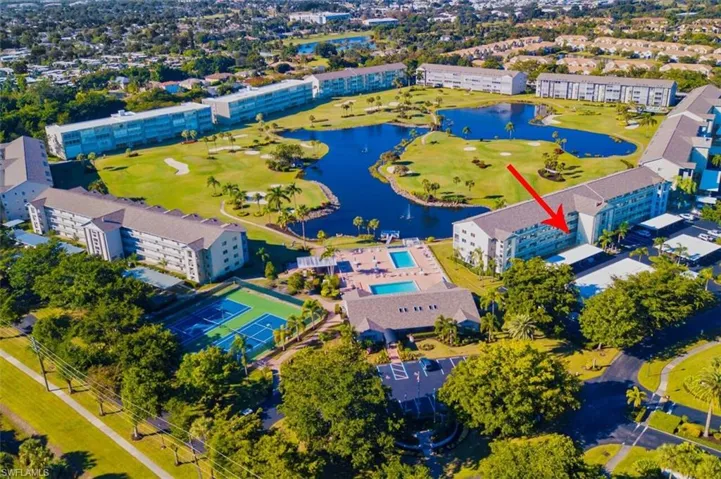 Bird's eye view of apartment complex and a large body of water