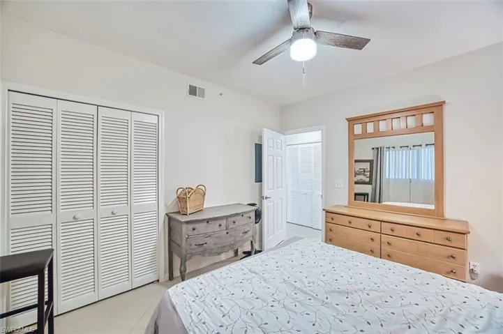 Bedroom featuring a closet and a ceiling fan
