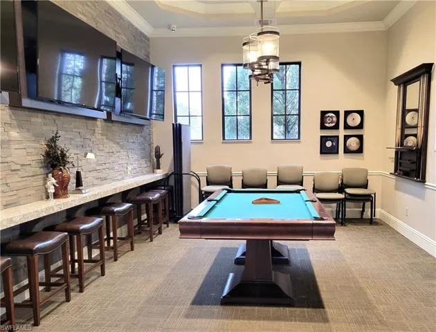 Rec room with billiards table and crown molding