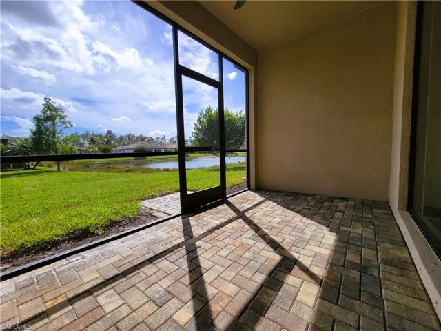 Unfurnished sunroom with a water view