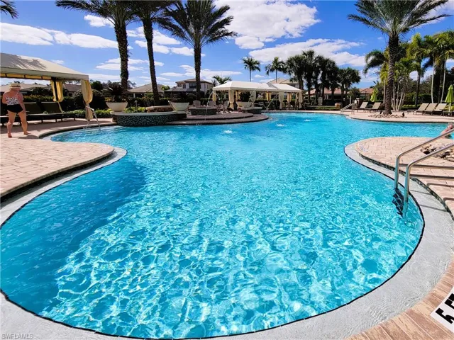Community pool featuring a patio area and a gazebo