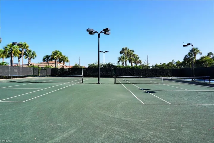 View of tennis court with community basketball court