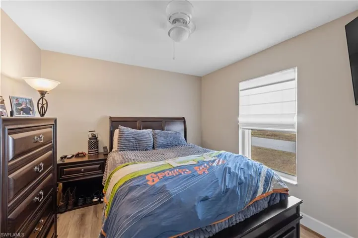 Bedroom featuring light wood-type flooring and ceiling fan