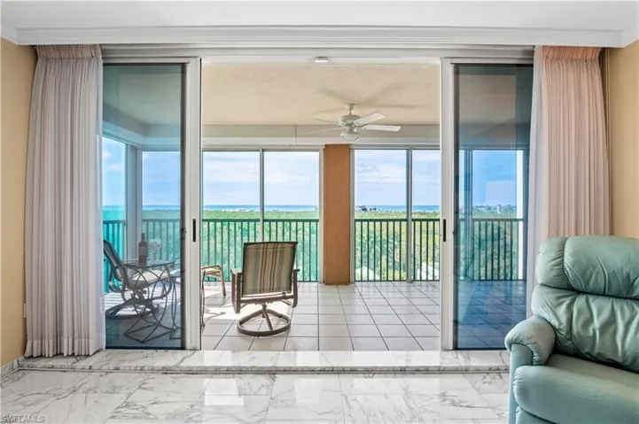 Large Screened Balcony with floor to ceiling windows and marble finish flooring