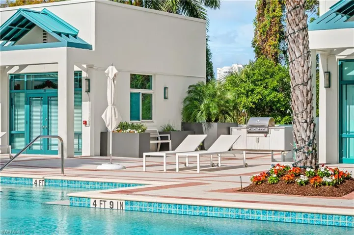Outdoor pool with french doors and exterior kitchen