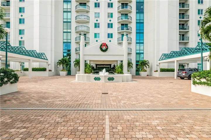 View of front of the high rise building's entry