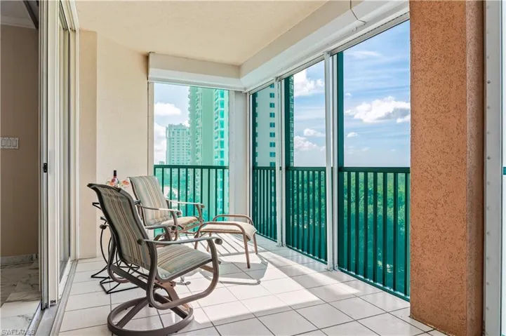 View of large screened balcony looking towards the Gulf