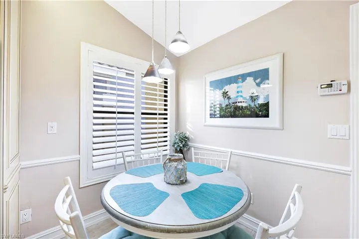 Dining space with lofted ceiling