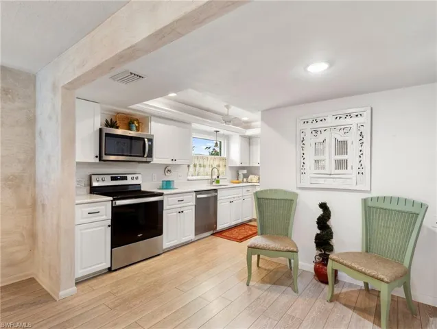 A wall was removed creating a much more spacious kitchen/breakfast area