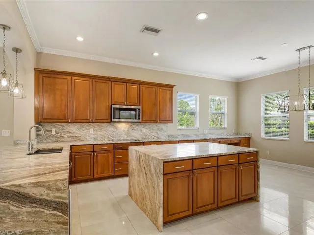 Over-sized kitchen with new granite tops...