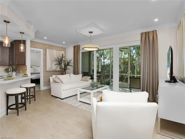 Living room featuring crown molding
