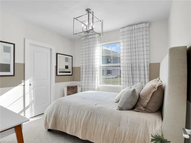 Bedroom featuring a chandelier