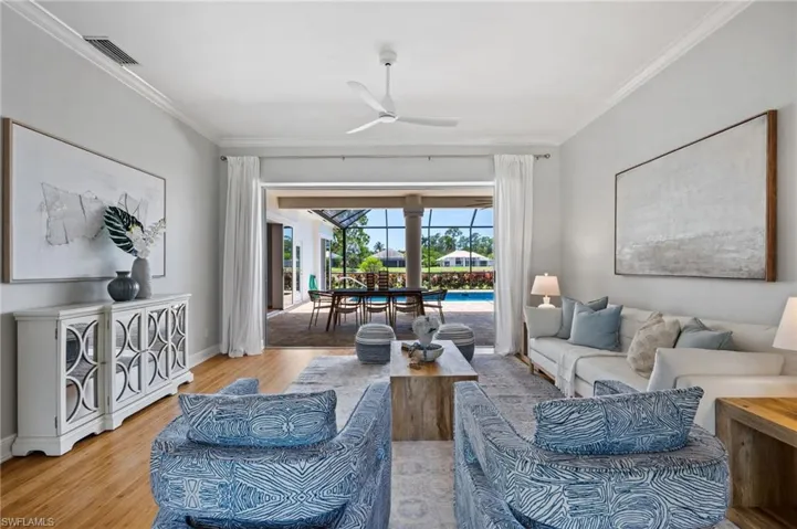 Serene interiors with direct views to the pool and outdoor dining area