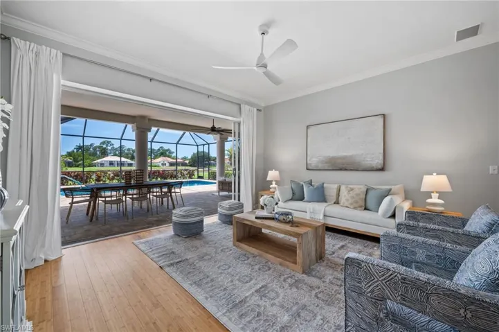 Inviting living area with tranquil views of the screened lanai and pool.