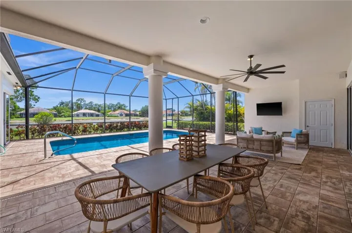 Ideal outdoor entertaining space with pool, patio, and scenic views
