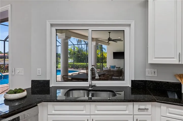 Thoughtfully designed kitchen with view of the outdoor entertaining space