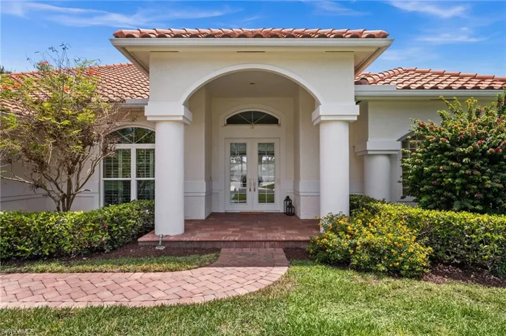 Welcoming front entry with covered portico and classic architectural detail