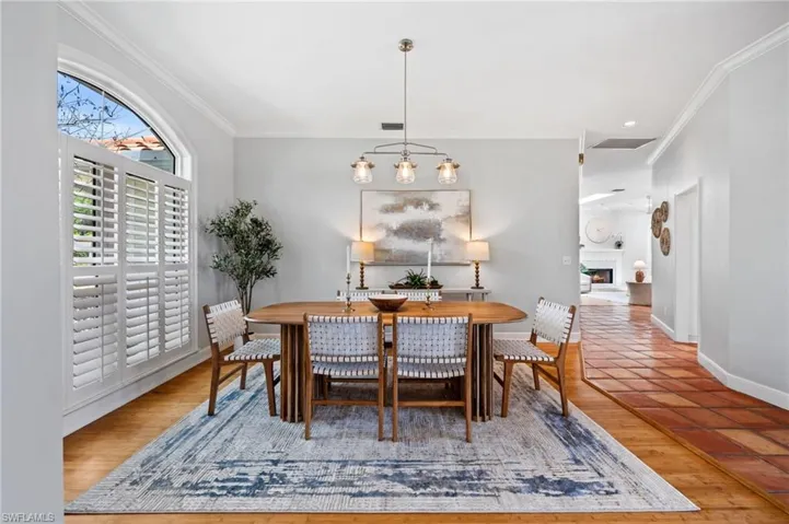 Formal dining room with abundant natural light and elegant finishes