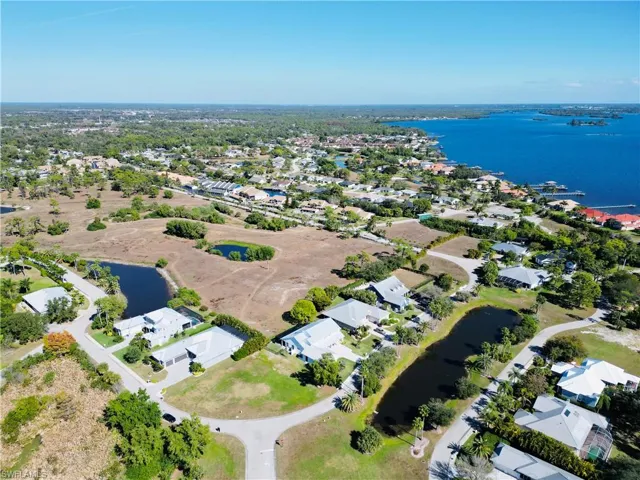 Aerial perspective of suburban area with a large body of water