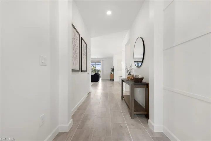 Corridor with light tile patterned floors