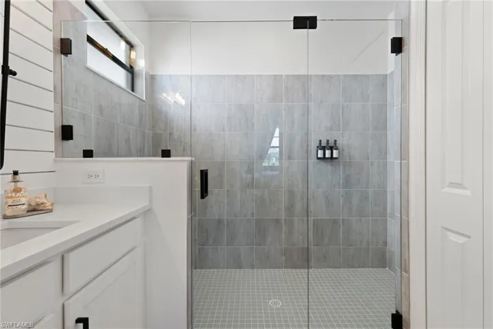 Bathroom with vanity and walk in shower