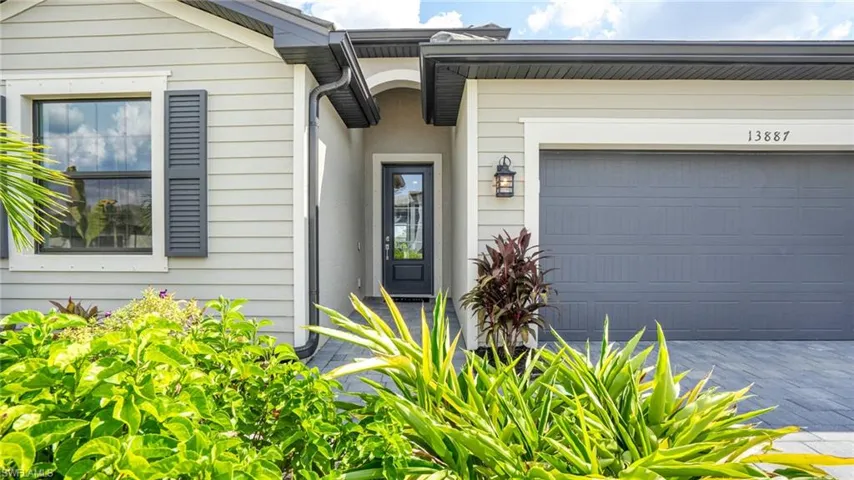 View of exterior entry featuring a garage