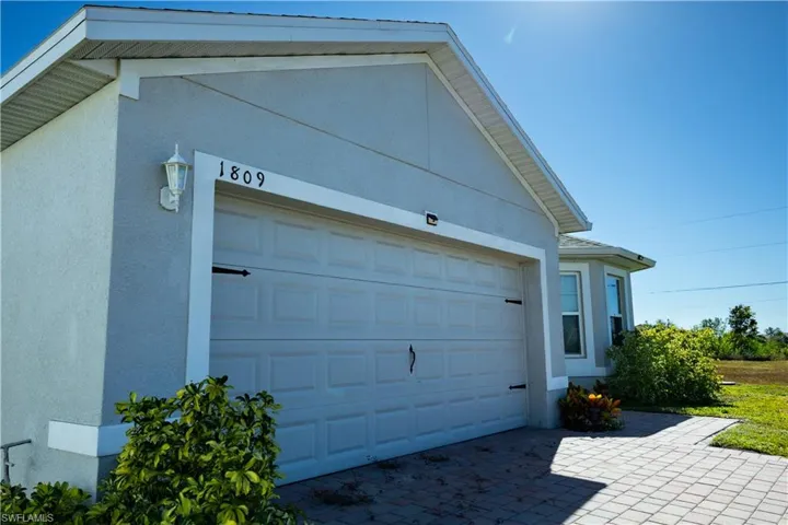 Garage featuring driveway