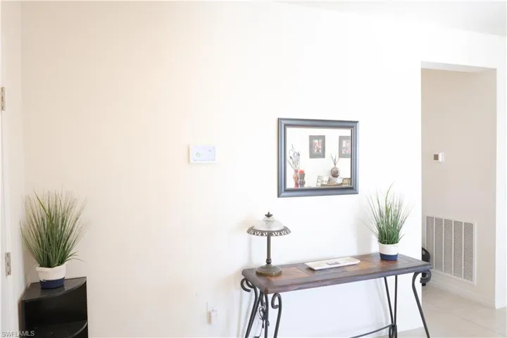 Home office featuring visible vents and light tile patterned floors