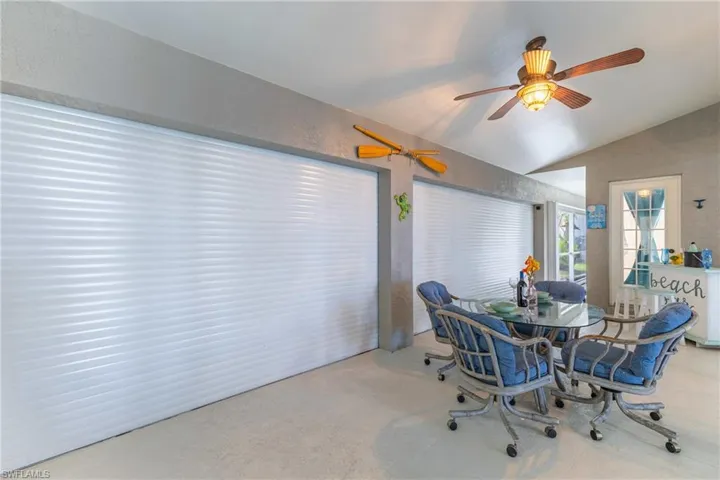 Dining room featuring lofted ceiling and a ceiling fan