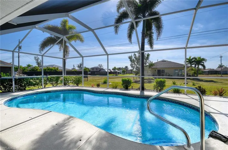 View of pool with a lanai