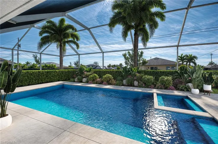 VIRTUAL REMODEL W/NEW POOL and LANDSCAPING: View of pool featuring a patio and a lanai