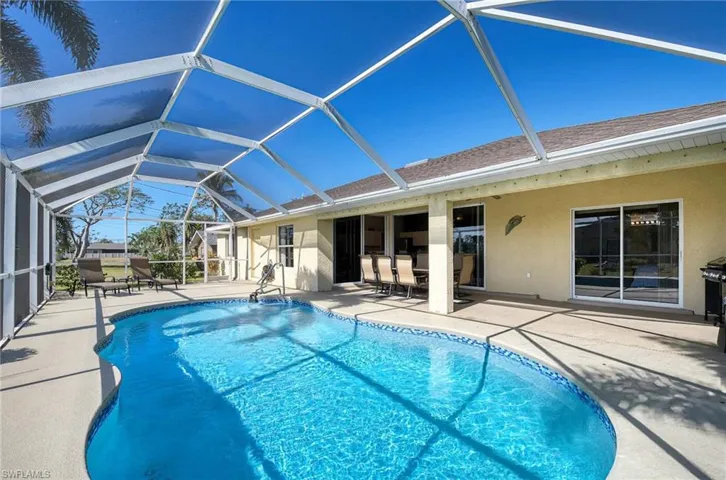 View of pool featuring a lanai and a patio area