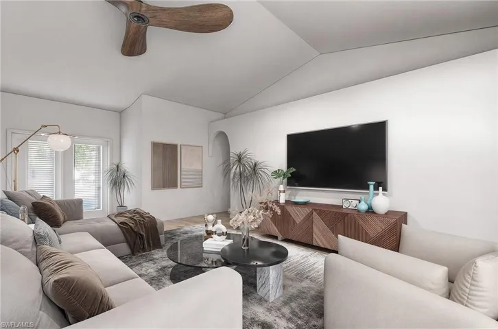 VIRTUAL REMODEL/STAGING: Living room with ceiling fan, lofted ceiling, and hardwood / wood-style flooring