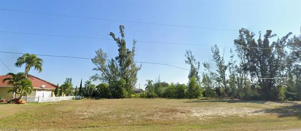 Expansive undeveloped lot featuring natural vegetation and cleared areas