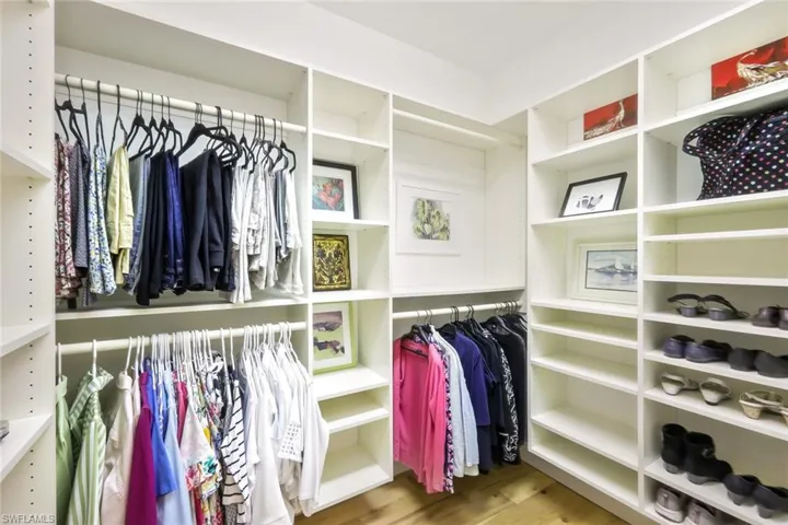 Spacious closet with wood finished floors