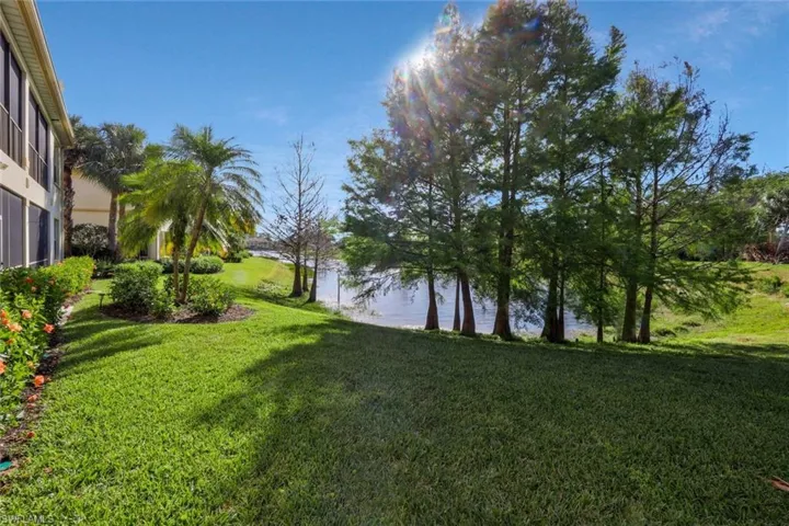 View of yard with a water view