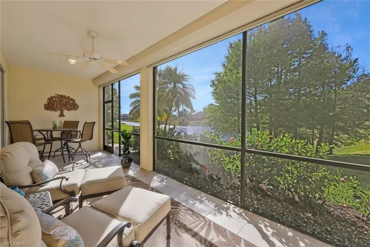 Lanai with a water view and tile patterned floors