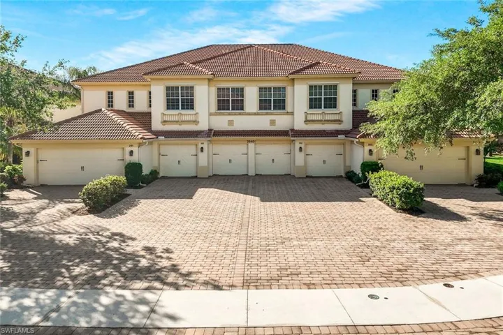 Mediterranean / spanish-style home featuring stucco siding, a tile roof, and driveway