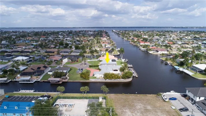Birds eye view of property featuring a residential view and a water view