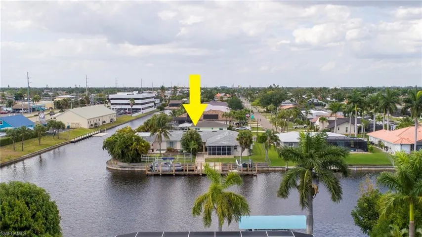 Drone / aerial view featuring a water view and a residential view