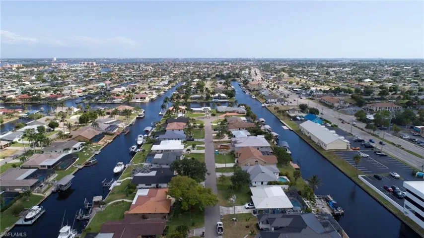 Drone / aerial view with a water view and a residential view