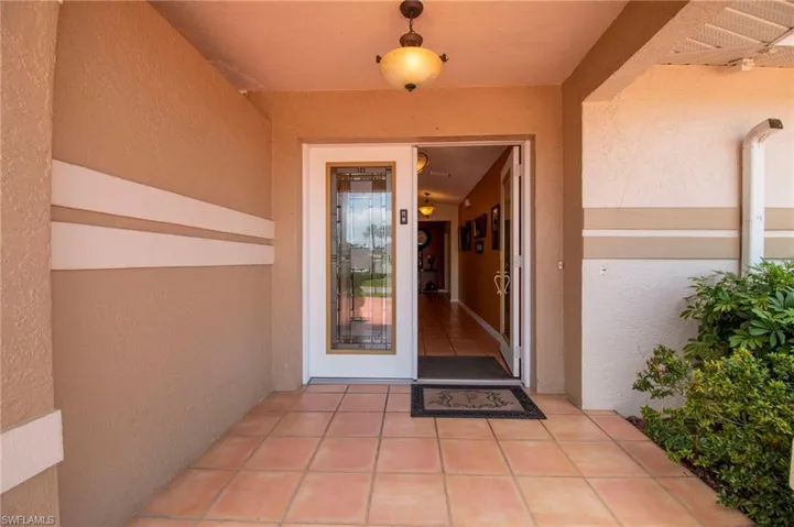 View of exterior entry with stucco siding