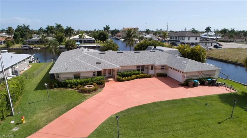Aerial view featuring a water view and a residential view