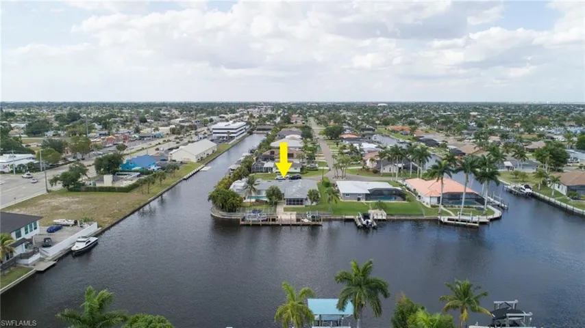 Drone / aerial view with a water view and a residential view