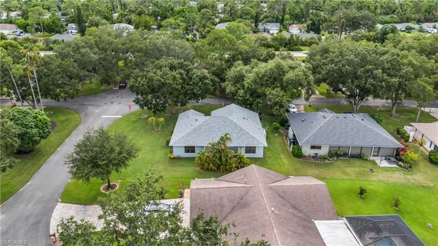Corner lot with large side yard and oak tree canopy quiet street