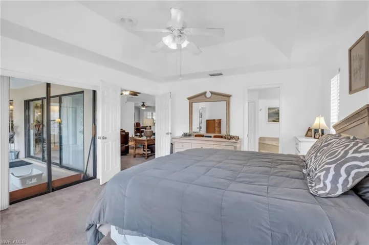 Master Bedroom w/Slider to the lanai, dbl door to the living room and master bathroom w/walk-in closet
