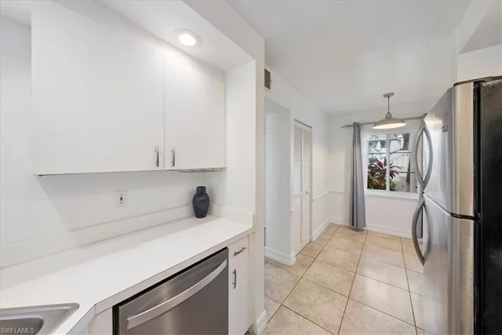 kitchen leading to eat in dining area