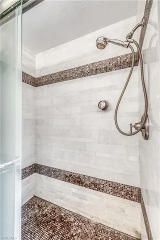 Full bath with a tile shower