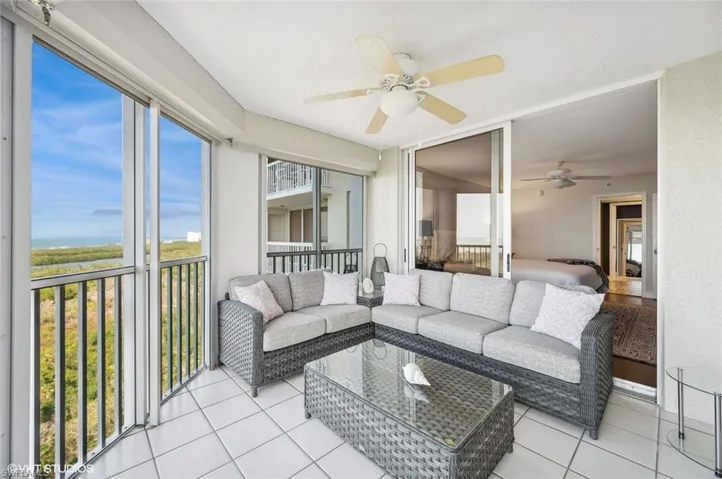 Sunroom featuring ceiling fan